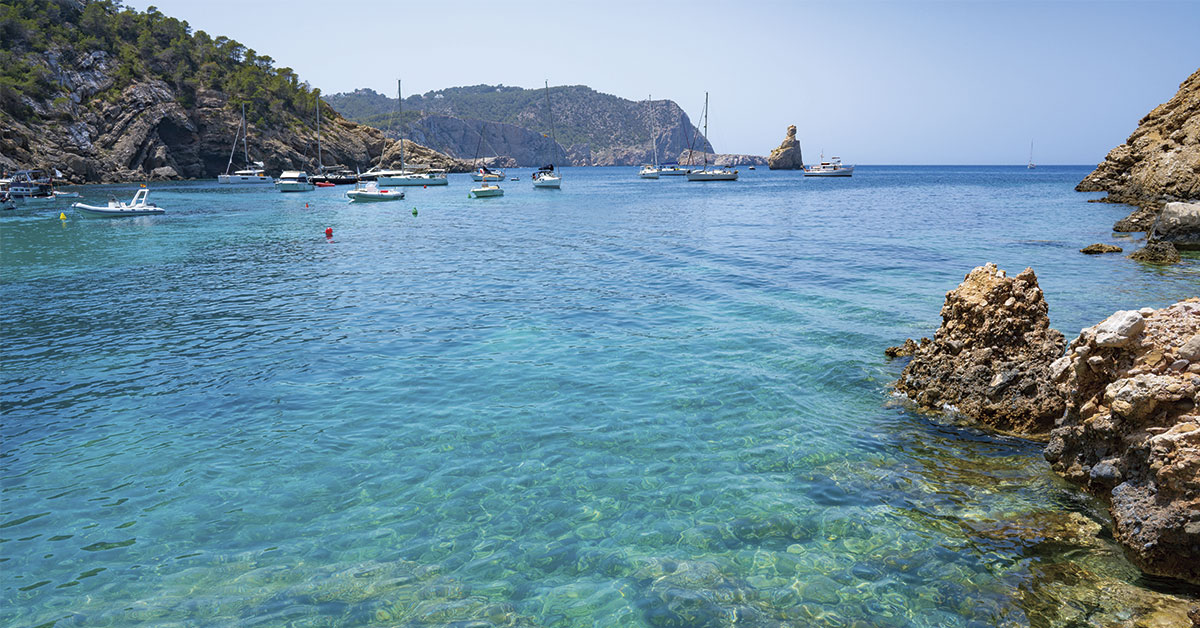 benirras cove with boats at anchor